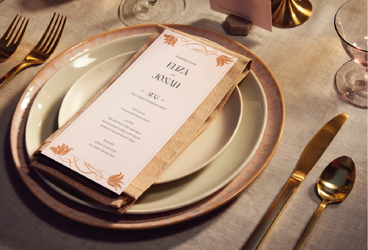 Custom printed menu plate cards for a wedding place setting.