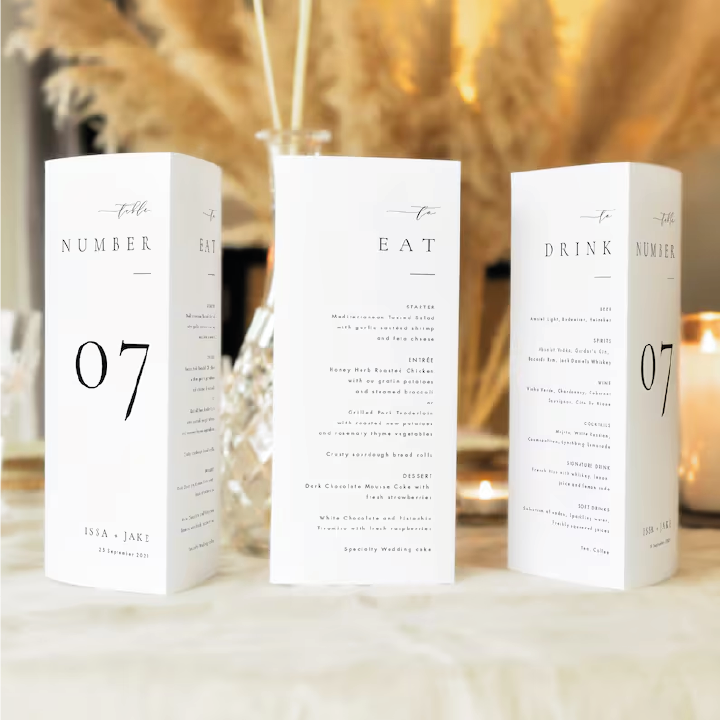 Custom tri-fold table number cards with printed menu and QR code for a wedding reception.